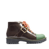 Single buckles boot in brown calf leather with green rubber tip