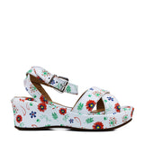 Sandals in white leather with platform and iconic flower print