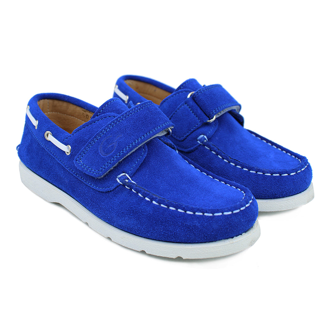 Bright blue suede boat shoes with white details