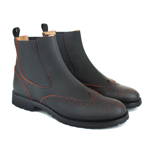 Chelsea boot in gummy black leather and orange details