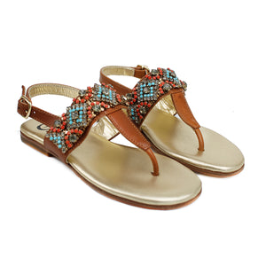 Flip Flops in tan leather with ethnic accessories