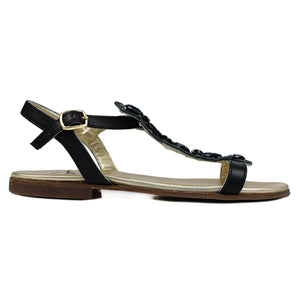 Sandals in black leather with black bright accessories on top