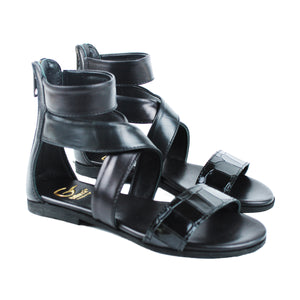 Sandals in black leather and exotic details
