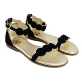 Sandals in black suede with round shaped edges