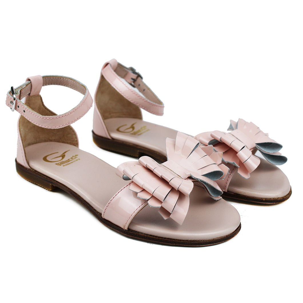 Sandals in pink patent leather and leather butterfly on strap